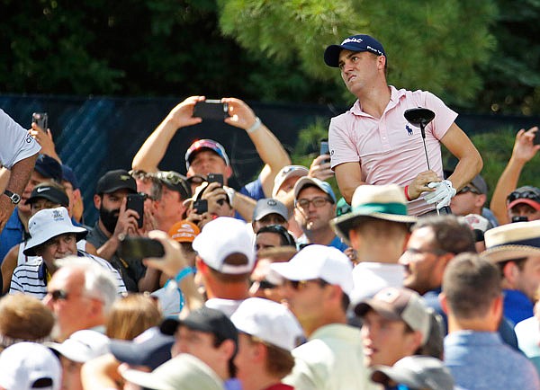 Justin Thomas watches his tee shot on the 15th hole Wednesday during a practice round for the PGA Championship at Bellerive Country Club in St. Louis.