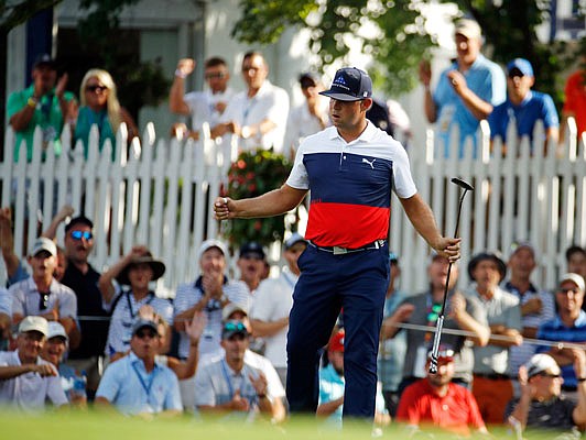Gary Woodland reacts after sinking a birdie putt on the 16th hole during Thursday's first round of the PGA Championship at Bellerive Country Club in St. Louis.