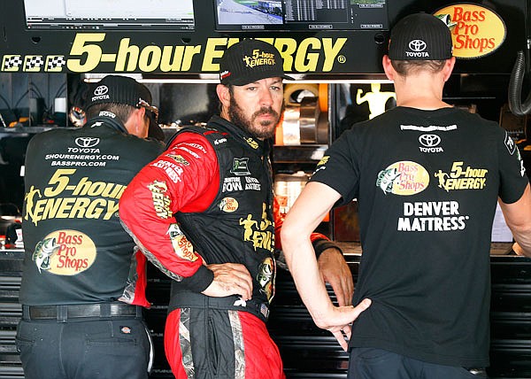 Martin Truex Jr. watches his crew work during Saturday's practice for a NASCAR Cup Series race at Michigan International Speedway in Brooklyn, Mich.