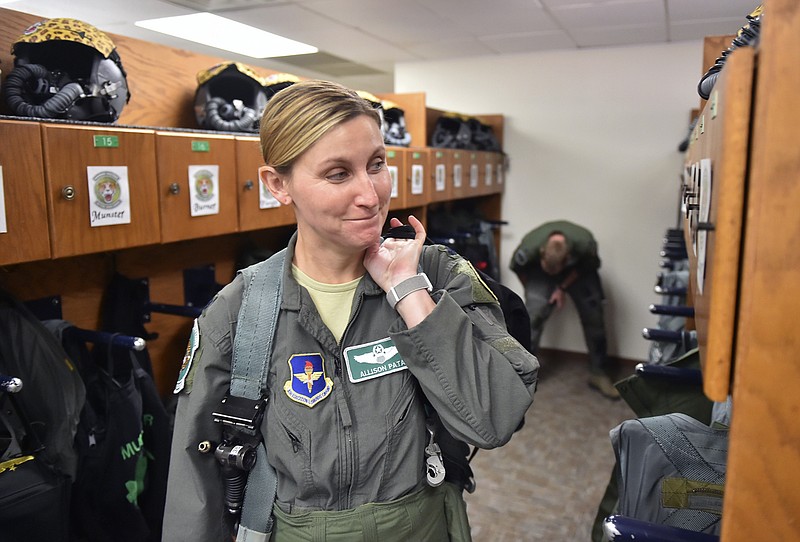 Air Force Lt. Col. Allison Patak is suited up prior to a training flight from Joint Base San Antonio Randolph. (Robin Jerstad/The San Antonio Express-News via AP)