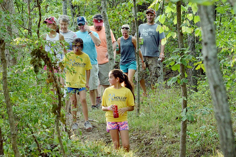 Participants walk toward the end of the trail Saturday, Aug. 11, 2018, before 7th annual Kick in the Sticks trail race began at Binder Park. Participants had the option to run or walk the 1.2-, 3.5- or 7.5-mile trails to raise funds toward supporting Jefferson City Rotaract's service partners, The HALO Foundation and The Food Bank for Central & Northeast Missouri.