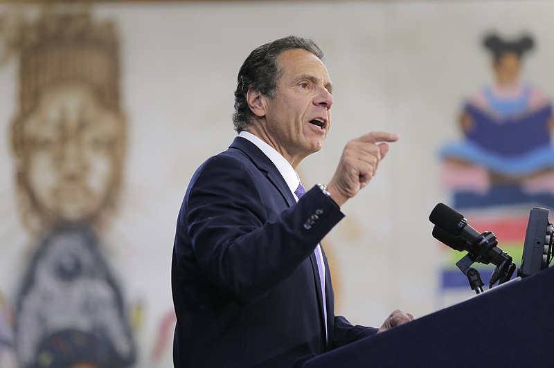 FILE - In this  July 5, 2018, file photo, New York Gov. Andrew Cuomo speaks at an event in the Brownsville section of Brooklyn in New York. At an event in the Adirondacks, Cuomo recounted a treasured memory of the time his family retrieved an eagle feather from Saranac Lake and kept it after one of the beautiful birds swooped near his canoe. In telling the story, the New York Democrat was unknowingly confessing a crime. A federal law prohibits non-Native Americans from possessing bald eagle parts, including feathers. (AP Photo/Seth Wenig, File)