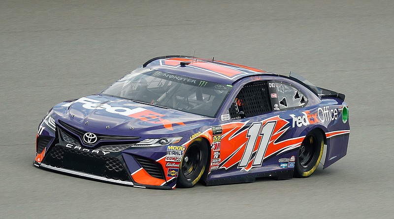 Denny Hamlin qualifies for a NASCAR Cup Series auto race at Michigan International Speedway in Brooklyn, Mich., Friday, Aug. 10, 2018. Hamlin won the pole position. (AP Photo/Paul Sancya)