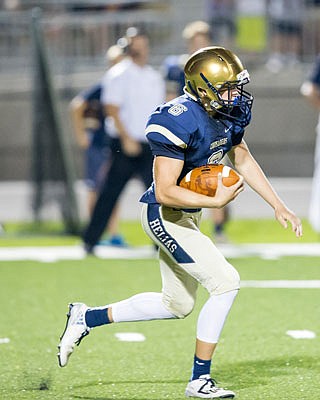 Zach Woehr of Helias runs back a kickoff for a touchdown in the third quarter of last year's season opener against Hannibal at the Crusader Athletic Complex.