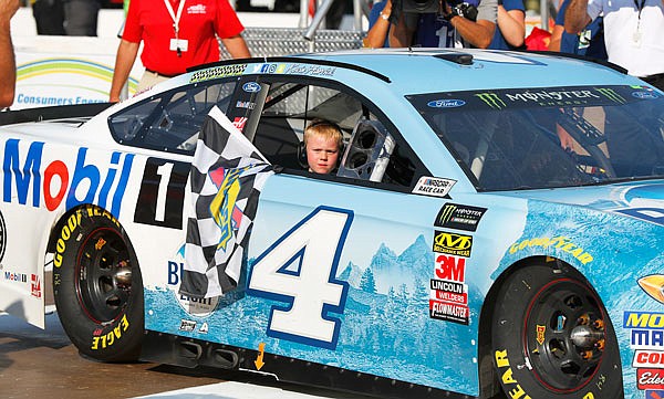 Kevin Harvick's son, Keelan, rides into winner's circle with his father after Sunday's NASCAR Cup Series race at Michigan International Speedway in Brooklyn, Mich.