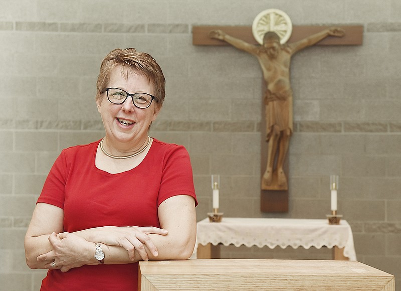 Helen Osman poses in the chapel of the Jefferson City Diocese Chancery offices on West Main Street.