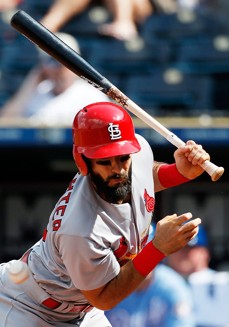  St. Louis Cardinals batter Matt Carpenter is hit by a pitch from Kansas City Royals relief pitcher Wily Peralta in the ninth inning of a baseball game Sunday at Kauffman Stadium in Kansas City, Mo.