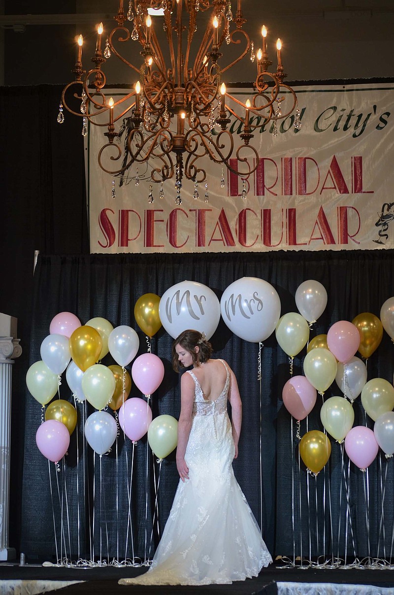 (Photo by Lindsey Simon) Low backs, lace and small straps on casual, romantic style dresses were a big trend for wedding gowns seen during the 2018 Bridal Spectacular's fashion show Jan. 7 at The LINC.