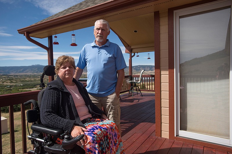 Robbin and Ed Smith are photographed at home in Castle Rock, Colo., in 2017. Robbin was paralyzed from the waist down after receiving an epidural pain injection at the Surgery Center at Lone Tree in 2013.
