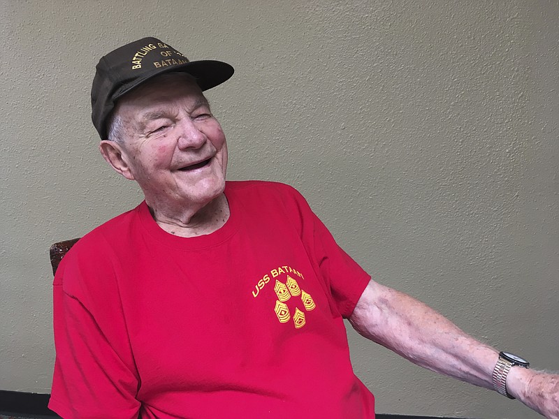 In this Monday Aug. 13, 2018, photo, Daniel Crowley, a 96-year-old U.S. Army Air Corps veteran from World War II who was held by Japan as a prisoner of war in the Philippines and Japan, speaks during an interview in Honolulu. Crowley is visiting Honolulu to help dedicate a new memorial marker honoring U.S. and Allied prisoners of war killed when U.S. planes bombed a Japanese freighter transporting the POWs. (AP Photo/Audrey McAvoy)