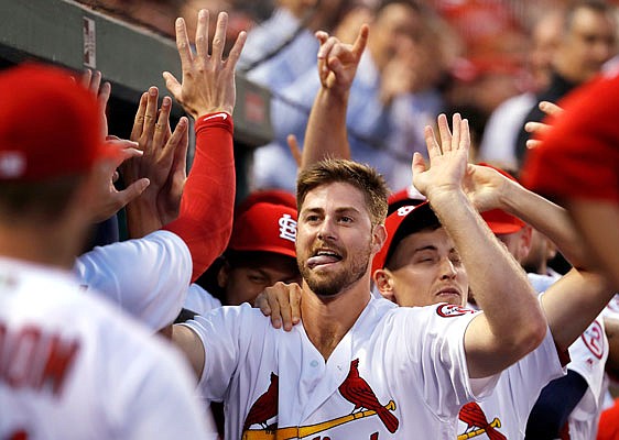 Cardinals starting pitcher John Gant is congratulated by teammates after hitting a two-run home run during the second inning of Tuesday night's game against the Nationals at Busch Stadium.