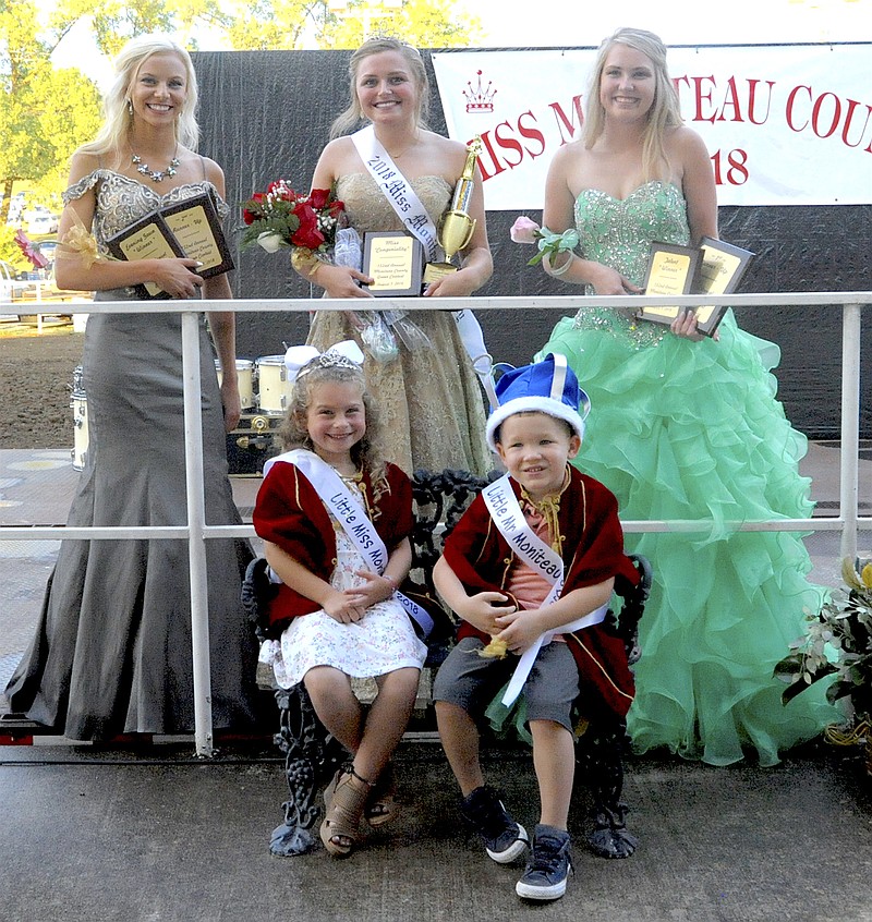 Moniteau County Fair 2018 queen is Halle Oliver. She is surrounded by Emily Strein, left, second runner-up; Alyssa Sabartinelli, right, first runner-up; Little Miss McKenzie Reed, seated left; and Little Mr. William Groepper, seated right.