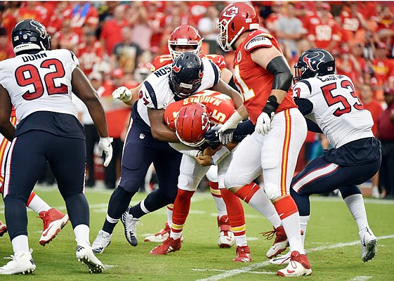 Chiefs quarterback Patrick Mahomes is sacked by Texans defensive end Angelo Blackson during last Thursday's exhibition game at Arrowhead Stadium.
