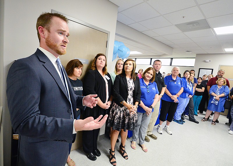 Jeff Davis, chief executive officer of the Community Health Center, makes opening remarks and welcomes guests Wednesday during a grand opening and ribbon cutting.