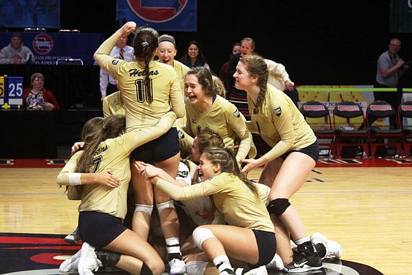 The Helias volleyball team celebrates on the court after winning the 2017 Class 3 state championship last October at the Show Me Center in Cape Girardeau.