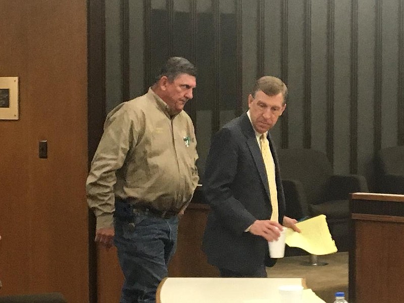 A Bowie County deputy sheriff, left, escorts Todd Peck from the courtroom during a recess in his trial Wednesday. Peck is facing 25 to 99 years or life in prison if found guilty of sexually abusing a girl who lived in his home for five years. The girl, now 14, and four other alleged victims testified Wednesday.
