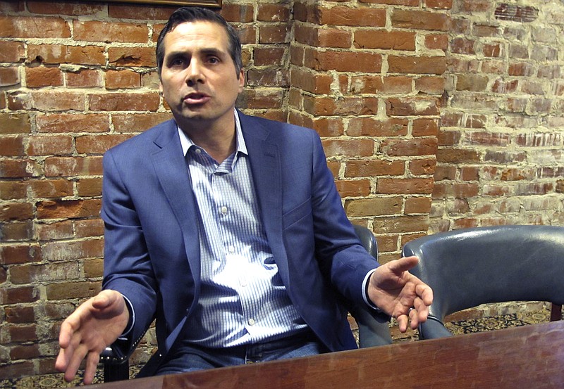 FILE - In this Jan. 25, 2018, file photo, Kansas City-area businessman Greg Orman discusses his run for Kansas governor as an independent candidate during an interview in Topeka, Kan. Orman says many Kansas Republicans view their party's nominee, Kris Kobach, as not only extreme, but incompetent and corrupt. He believes those Republican voters will be attracted to his background as a businessman. Orman said Friday, Aug. 17, 2018, he expects his business experience will also draw to him Democratic voters who view the governor's job as not just a policy job but a management job. (AP Photo/John Hanna, File)
