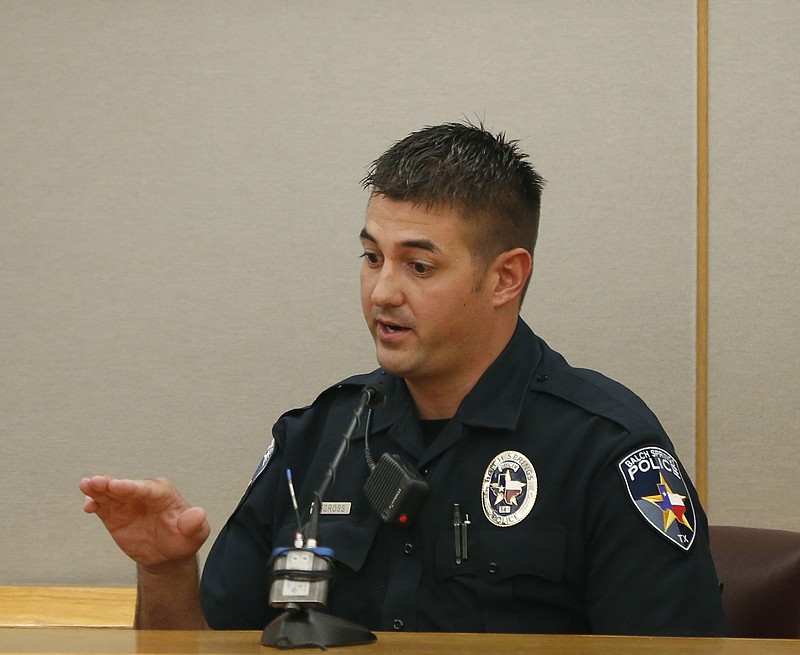 Balch Springs police officer Tyler Gross gives testimony for lead prosecutor Michael Snipes during the first day of the trial of fired Balch Springs police officer Roy Oliver, who is charged with the murder of 15-year-old Jordan Edwards, at the Frank Crowley Courts Building in Dallas on Thursday, Aug. 16, 2018. (Rose Baca/The Dallas Morning News via AP, Pool)