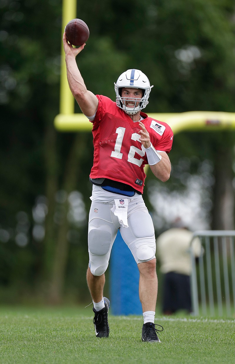 Indianapolis Colts quarterback Andrew Luck (12) throws during a joint practice with the Baltimore Ravens at the Colts NFL football training camp in Westfield, Ind., Friday, Aug. 17, 2018. (AP Photo/Michael Conroy)