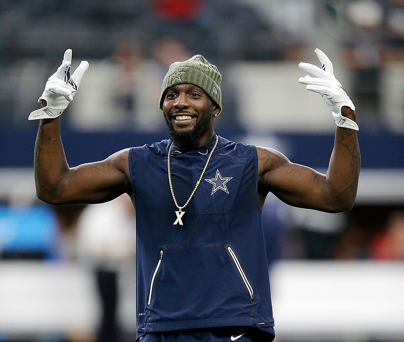  In this Nov. 5, 2017, file photo, Dallas Cowboys wide receiver Dez Bryant (88) warms up before an NFL football game against the Kansas City Chiefs, in Arlington, Texas. Dez Bryant has dropped in to meet the Browns. The three-time Pro Bowl wide receiver arrived at the team's headquarters on Thursday, Aug. 16, 2018, a visit that could lead to Bryant signing with Cleveland. Bryant posted a photo on Twitter of him signing autographs at Cleveland's airport.(AP Photo/Brandon Wade, File)