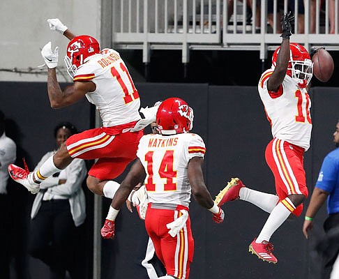 Chiefs wide receiver Tyreek Hill (right) celebrates his touchdown with teammate Demarcus Robinson during the first half of Friday night's exhibition game against the Falcons in Atlanta.