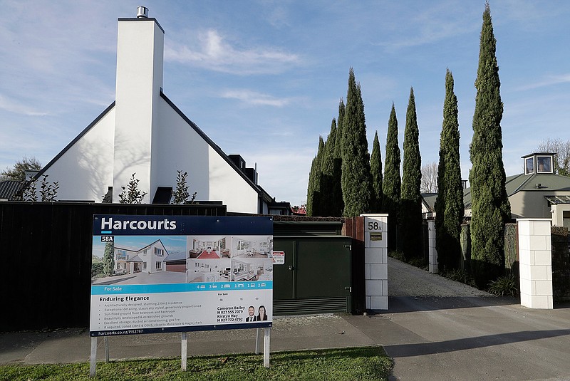 In this Aug. 13, 2018, photo a house is pictured for sale in Christchurch, New Zealand.  New Zealand has banned most foreigners from buying homes as it tries to tackle runaway housing prices. The government on Wednesday, Aug. 15 passed legislation that allows only New Zealand residents to buy homes as it attempts to improve housing affordability and increase the rate of home ownership. (AP Photo/Mark Baker)