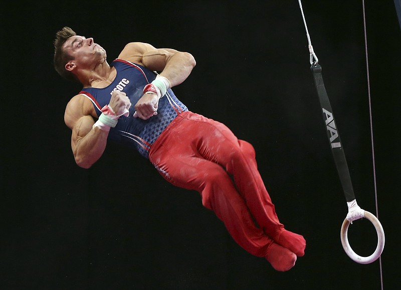 Sam Mikulak competes on the rings at the U.S. Gymnastics Championships, Saturday, Aug. 18, 2018, in Boston. (AP Photo/Elise Amendola)