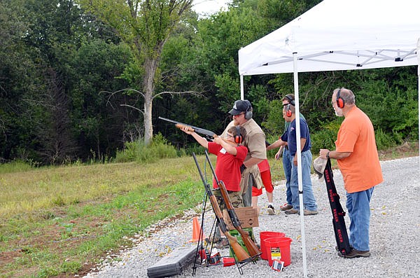 An aspiring dove hunter gains confidence under the instruction of MDC Outreach & Education Division Regional Supervisor Brian Flowers.