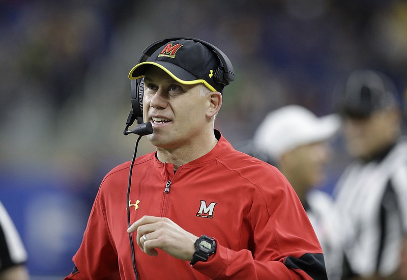 In this Dec. 26, 2016, file photo, Maryland head coach DJ Durkin walks the sideline during the Quick Lane Bowl against Boston College in Detroit.