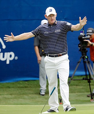 Brandt Snedeker drops his putter after sinking a shot on the 18th hole Sunday at the Wyndham Championship in Greensboro, N.C.