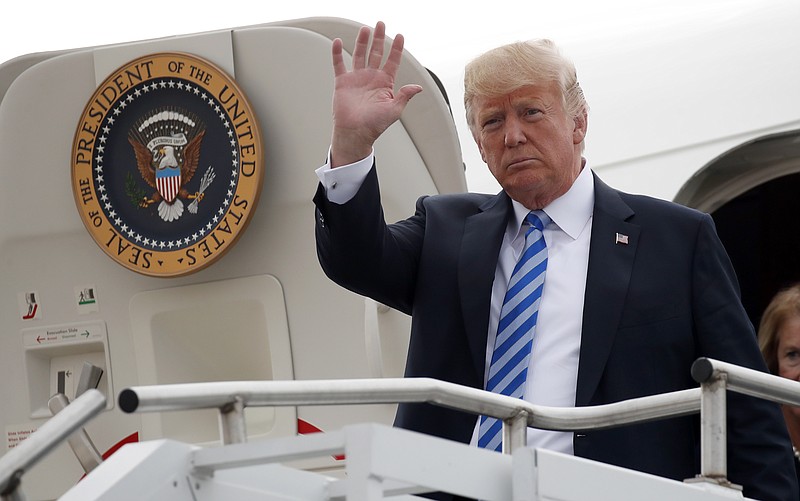 President Donald Trump waves as he steps off Air Force One, Tuesday, Aug. 21, 2018, in Charleston, W.Va. (AP Photo/Alex Brandon)