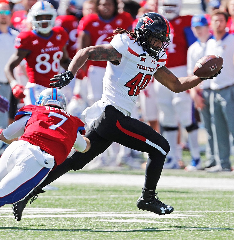 Texas Tech's Dakota Allen carries the ball after making an interception during a game against Kansas on Oct. 7, 2017, in Lawrence, Kan. After being Tech's second-leading tackler as a freshman in 2015, the linebacker was involved in an off-field incident that led to his being kicked off the team and out of school. He thought his football career was over. But he spent the 2016 season with the first team featured in Netflix's "Last Chance U" series, then got the opportunity to return to Texas Tech. He now goes into his senior year as a preseason All-Big 12 pick.