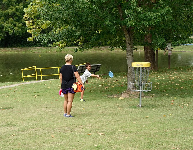 Princeton Miller, 11, participated in his first disc golf tournament Saturday at Veterans Park in Fulton with the support of his mother, Theresa. "I get to play with my cousins, too," he said. Theresa said Princeton has only been playing for a few of months, driving over from their home in Columbia so he can practice with his cousins in Fulton.