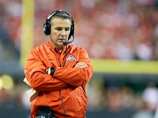 In this Dec. 2, 2017, file photo, Ohio State coach Urban Meyer stands on the sideline during the Big Ten title game against Wisconsin in Indianapolis.