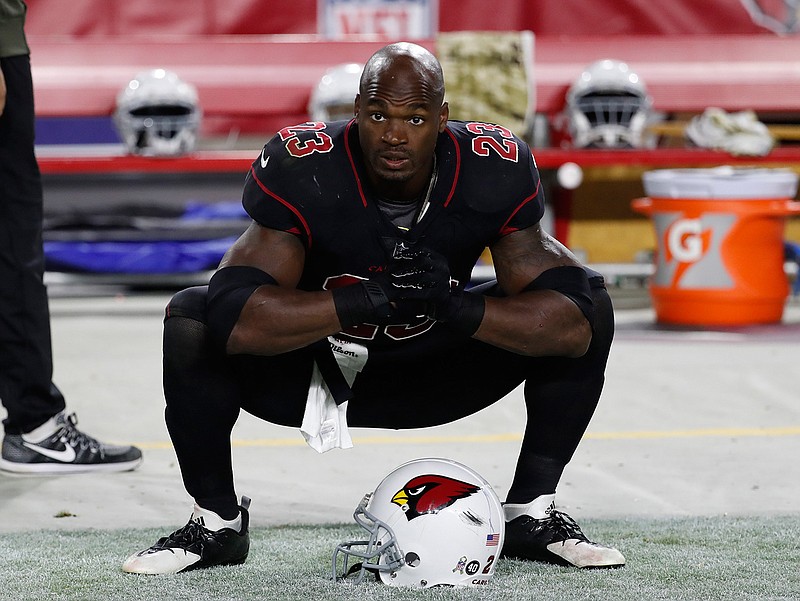 In this Nov. 9, 2017 file photo Arizona Cardinals running back Adrian Peterson (23) watches at the sideline during an NFL football game against the Seattle Seahawks in Glendale, Ariz. The Washington Redskins have signed Peterson. The team announced the deal Monday, Aug. 20, 2018 after meeting with him. (AP Photo/Rick Scuteri, file)