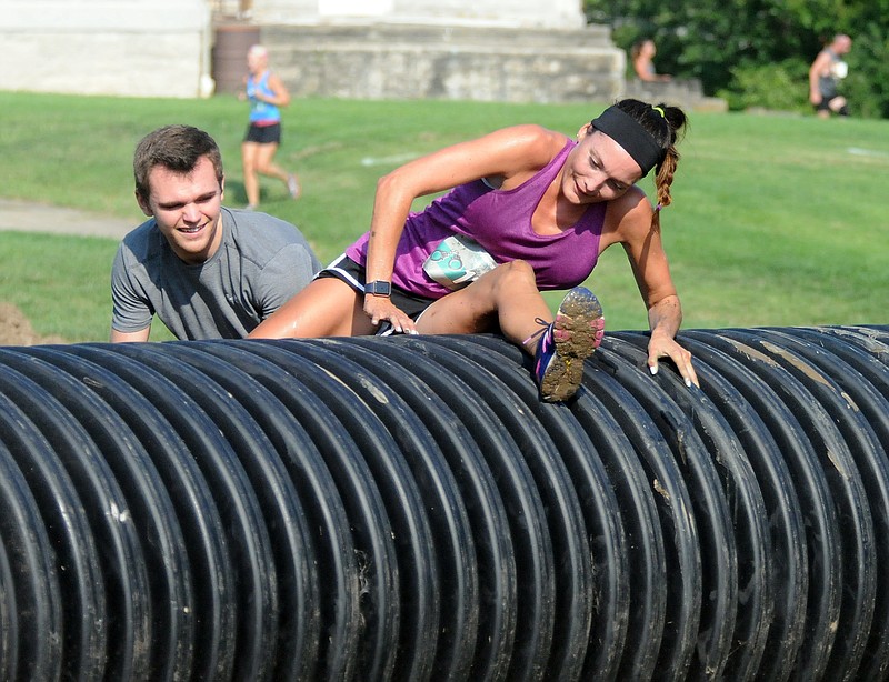 Mark Wilson/News Tribune
Runners participating in the 7th Annual Prison Break Race run through the 'Catch Me If You Can Fun Run & Obstacle Course' at  Ellis-Porter Park Saturday morning.