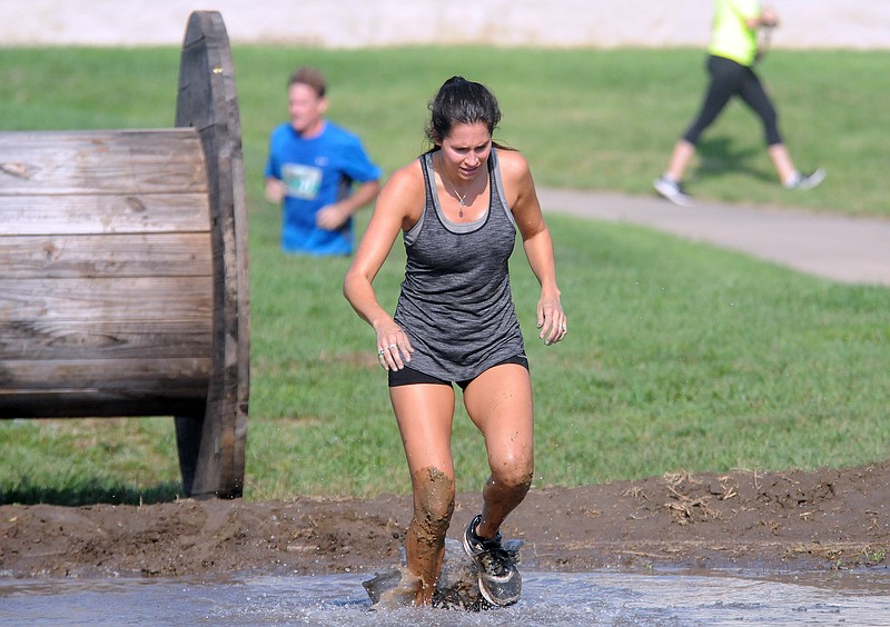 Mark Wilson/News Tribune
Runners participating in the 7th Annual Prison Break Race run through the 'Catch Me If You Can Fun Run & Obstacle Course' at  Ellis-Porter Park.