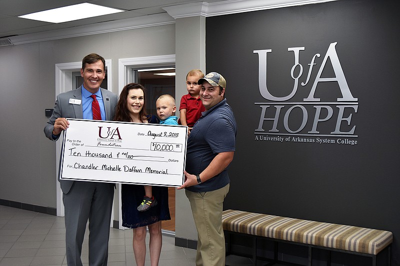 Jessica and Christopher Daffern recently established the Chandler Michelle Daffern Memorial Endowed Scholarship at the University of Arkansas Hope-Texarkana in honor of their late daughter who died due to a congenital diaphragmatic hernia. From left, Chris Thomason, UA Hope-Texarkana chancellor; Jessica Daffern; Cason Martin, son; Kyler Daffern, son; and Christopher Daffern. (Submitted photo)
