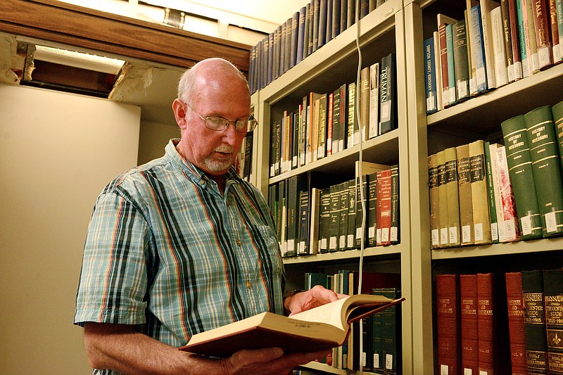Sally Ince/ News TribuneDarrell Strope looks in a books August 20 in the research library at the Cole County Historical Society. Strope has been a research volunteer with the society since 2013. Much of his work has recently consisted of inventory and indexing historical information and has a passion for preserving history.