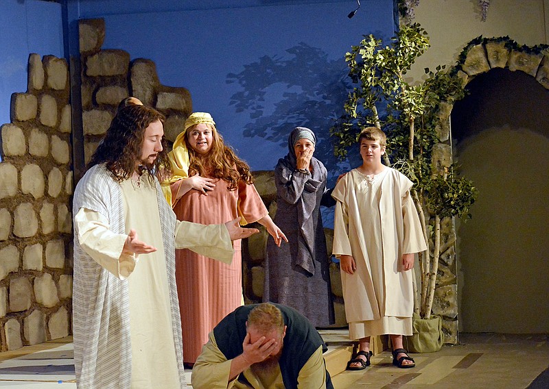 Sally Ince/ News Tribune
Emmett Spradlin, left, playing Jesus, prays over Joey Wyss, Right, playing Thomas, Monday during a dress rehearsal at Stained Glass Theatre. Stained Glass Theatre's upcoming show of "John, His Story" is based on John 20:31 as re-telling of Jesus' seven miracles.