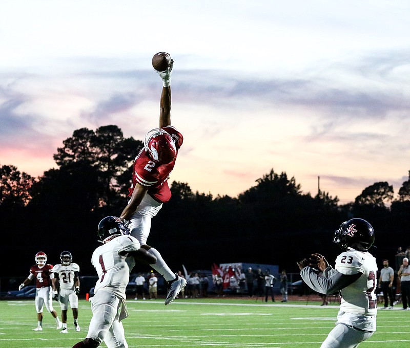 Razorback's wide receiver Irijah Price attempts to catch a pass with one hand for a touchdown on Friday at Arkansas High School in Texarkana, Ark.