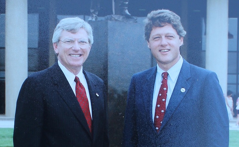 Texas Gov. Mark White, left, and Arkansas Gov. Bill Clinton pose for a photo at the dedication ceremony for the statue of James Bowie at the Bowie County Courthouse on June 28, 1986, in New Boston, Texas. (Photo courtesy 3 Bostons Museum)