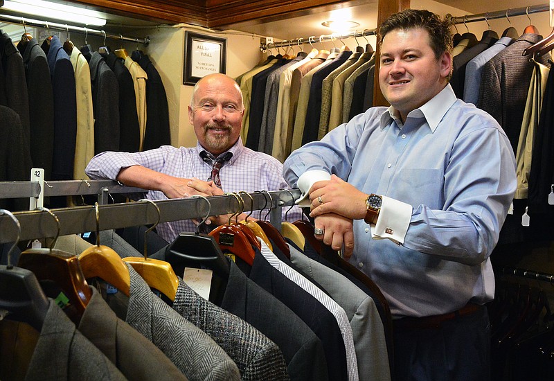 BIZBEAT High Handsome
Mark Wilson/News Tribune
High Handsome Men's Exchange & Consignment Clothiers owner Steve Gilplin, left, is selling the business to Tyler Woods, on the right. Thursday was Gilpin's second to last day on the job. 