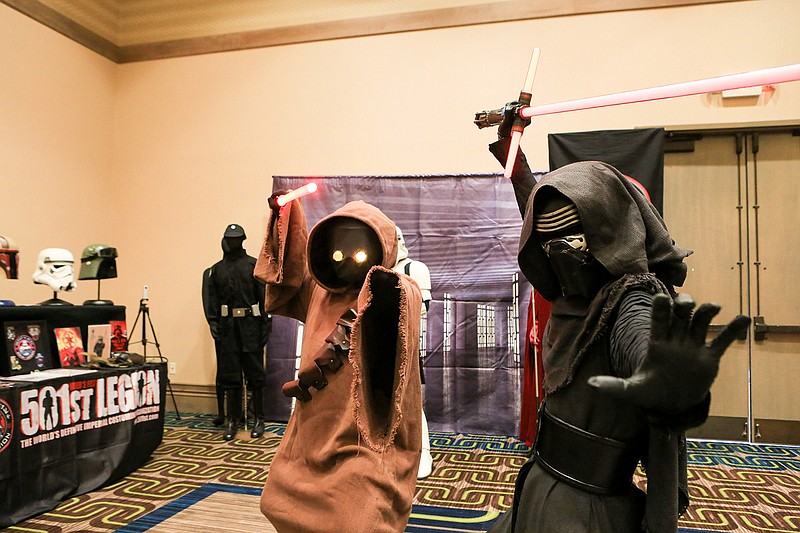 Desiree Damon and Chris Pennington pose for a photo in their Jawa and Kylo Ren costumes from the Star Wars series on Saturday, Sept. 1, 2018, at the Texarkana Comic Convention in Texarkana, Texas.