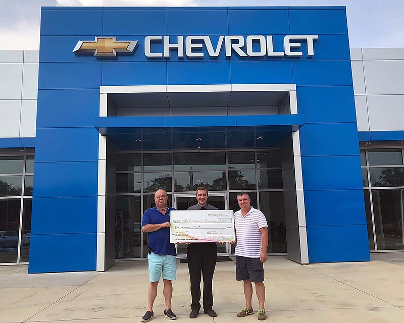  Gentry Chevrolet of De Queen, Ark., recently donated $5,000 to the University of Arkansas Cossatot Foundation Legacy 2020 capital campaign. The check presentation included, from left, Gentry Chevrolet co-owner Bud Gentry, UA Cossatot Coordinator of Development Dustin Roberts and Gentry Chevrolet co-owner Jimmy Ray Gentry. Because of the donation, a lab on UA Cossatot's De Queen campus is now named The Gentry Chevrolet Lab. (Submitted photo)
