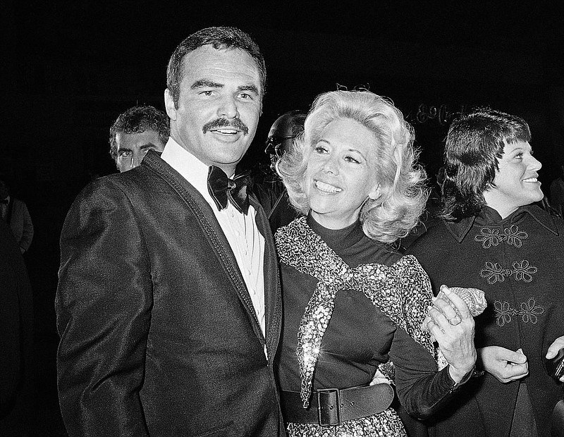 In this Nov. 5, 1971 file photo, actress Dinah Shore and Burt Reynolds appear together in Los Angeles. Reynolds, who starred in films including "Deliverance," "Boogie Nights," and the "Smokey and the Bandit" films, died at age 82, according to his agent. 