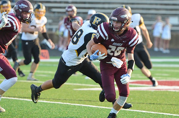 Matt Hans of School of the Osage takes off with the football during a game last month against Fulton in Osage Beach.