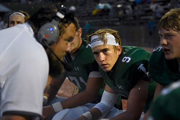 Blair Oaks sophomore Cade Stockman listens to assistant coach Andrew Terpstra during Friday's game against Boonville at the Falcon Athletic Complex in Wardsville.