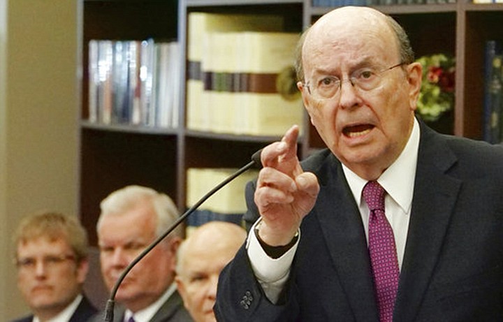 Quentin L. Cook, right, a high-ranking leader with The Church of Jesus Christ of Latter-day Saints, makes remarks during a news conference Tuesday, Sept. 4, 2018, in Salt Lake City. Mormon leaders unveiled a new narrative book about the faith's early history in the 1800s that follows a recent commitment to transparency by acknowledging the polygamous roots of the faith. Leaders with The Church of Jesus Christ of Latter-day Saints said at a news conference they hope book helps young faith members learn about early church history. (AP Photo/Rick Bowmer)