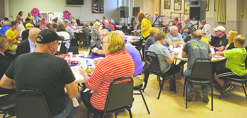 Active members of law enforcement, emergency medical services and firefighters enjoy a free chicken dinner at the second annual Patriot Sunday at American Legion Post 5.